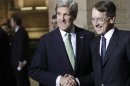 U.S. Secretary of State John Kerry shakes hands with Italian Foreign Minister Giulio Terzi, right, as he arrives at Villa Madama in Rome, Wednesday, Feb. 27, 2013. Kerry will attend an international conference on Syria in Rome Thursday. The United States is looking for more tangible ways to support Syria's rebels and bolster a fledgling political movement that is struggling to deliver basic services after nearly two years of civil war, Kerry said Wednesday. (AP Photo/Riccardo De Luca)
