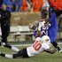 Tulsa's Ja'Terian Douglas is stopped for a short gain by Oklahoma State's Markelle Martin i in the first half of their NCAA college football game, Sunday, Sept. 18, 2011, in Tulsa, Okla. The game was delayed by a severe thunderstorm. (AP Photo/Dave Crenshaw)