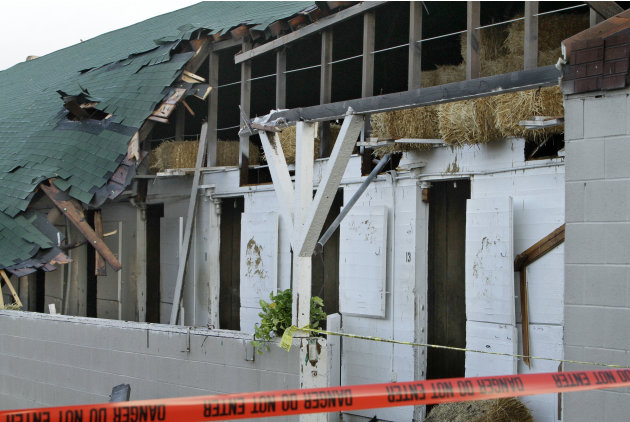 No horses nor people were injured when an apparent tornado struck the stable area at Churchill Downs in Louisville, Ky., late Wednesday night. At least nine barns were damaged, including this one show