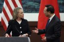 Chinese Foreign Minister Yang Jiechi, right, talks with U.S. Secretary of State Hillary Rodham Clinton after attending the press conference at the Great Hall of the People in Beijing, China Wednesday, Sept. 5, 2012. (AP Photo/Feng Li, Pool)