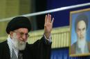 A photo released by the Center for Preserving and Publishing the Works of Iran's supreme leader Ayatollah Ali Khamenei shows him waving during a gathering in Tehran on November 27, 2014