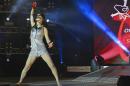 FILE - In this file photo dated Friday Aug. 29, 2014, showing the winner of the 2014 Air Guitar World Championships, the then 18-year old Nanami "Seven Seas" Nagura of Japan, as she performs in Oulu, Finland. What started off as a joke 20-years ago has turned into an annual fest of crazy mime artists pretending to play guitar, competing for the championship title of World Air Guitar champion. (Vesa Ranta/Lehtikuva via AP, FILE) FINLAND OUT - NO SALES
