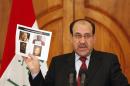 FILE - In this Monday, April 19, 2010 file photo, Iraq's Prime Minister Nouri al-Maliki holds a paper displaying photographs of a man the Iraqi government claims to be al-Qaida leader Abu Omar al-Baghdadi at a news conference in Baghdad, Iraq. U.S. and Iraqi forces killed the two top al-Qaida in Iraq leaders on April 18, 2010, allowing Abu Bakr al-Baghdadi to become the leader of a terror group weakened by a concerted campaign aimed at ending a Sunni insurgency in the country.(AP Photo/Hadi Mizban, File)