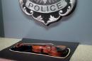 A $5 million Stradivarius violin is displayed at the Milwaukee Police Department Thursday, Feb. 6, 2014, in Milwaukee, a day after police recovered the instrument stolen on Jan. 27 from a concertmaster in a parking lot by a person wielding a stun gun. Police say the violin appears to be in good condition, and a Milwaukee County prosecutor said he planned to charge at least one suspect with felony robbery. (AP Photo/Dinesh Ramde)