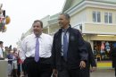 President Barack Obama and New Jersey Gov. Chris Christie walk along the boardwalk during their visit to Point Pleasant, NJ., Tuesday, May 28, 2013. Obama traveled to New Jersey to join Christie to inspect and tour the Jersey Shore's recovery efforts from Hurricane Sandy. (AP Photo/Pablo Martinez Monsivais)