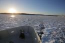 The Warren Jr. cuts a path through the ice as it works as an ice breaker for the commuter ferry in the waters off Hingham