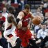 Los Angeles Clippers' Blake Griffin (32) drives past Portland Trail Blazers' Raymond Felton (5) in the second quarter of an NBA basketball game Thursday, Feb. 16, 2012, in Portland, Ore. (AP Photo/Rick Bowmer)