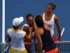 Sara Errani and Roberta Vinci of Italy shake hands with Ashleigh Barty and Casey Dellacqua of Australia after defeating them in their women's doubles final match at the Australian Open tennis tournament in Melbourne