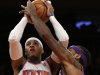 Los Angeles Lakers center Jordan Hill,right, gets his hand on the ball as New York Knicks forward Carmelo Anthony, left, goes up for a layup in the first half of their NBA basketball game at Madison Square Garden in New York, Thursday, Dec. 13, 2012.  (AP Photo/Kathy Willens)