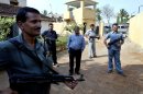 FILE – In this April 15, 2007 file photo, Mahendra Karma, center, lawmaker and founder of Salwa Judum, the government-supported militia to combat Communist rebels known as Naxalites, is surrounded by bodyguards at his residence in Jagdalpur, in the central Indian state of Chattisgarh. Karma was killed when Maoist rebels attacked a convoy of cars of Congress party leaders and supporters in eastern India, injuring several people on Saturday, May 25, 2013. The rebels have been fighting the central government for more than four decades, demanding land and jobs for tenant farmers and the poor. (AP Photo/Mustafa Quraishi, File)