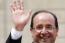 New President Francois Hollande waves as he leaves the Elysee Palace Tuesday, May 15, 2012 in Paris. (AP Photo/Thibault Camus)