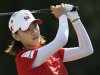 Choi Na-yeon of South Korea watches her drive from the 18th tee in Kohler, Wisconsin