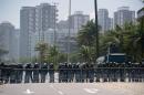 Security forces in riot gear form a line in front of the hotel where Brazil's National Petroleum Agency auctioned drilling rights to one of the world's largest offshore oil discoveries, in Rio de Janeiro on October 21, 2013