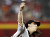 San Francisco Giants' Tim Lincecum releases a pitch against the Arizona Diamondbacks in the first inning of an MLB baseball game, Sunday, Sept. 25, 2011, in Phoenix. (AP Photo/Paul Connors)