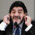Former Argentine soccer star Maradona gestures during a news conference in Naples