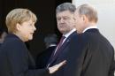 File photo of Ukraine president-elect Poroshenko German Chancellor Merkel and Russian President Putin