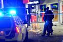 Police cordon off an area at a petrol station where a man was found severely injured after being shot on the sidelines of a pro-Kurdish demonstration in Fittja in southern Stockholm, Sweden, on February 13, 2016