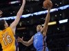 Oklahoma City Thunder guard Derek Fisher, right, puts up a shot as Los Angeles Lakers forward Pau Gasol, left, of Spain, defends and guard Steve Blake watches during the first half of an NBA basketball game, Thursday, March 29, 2012, in Los Angeles. (AP Photo/Mark J. Terrill)