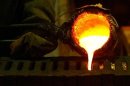 Refined gold is poured into moulds to be made into gold bars at South Africa's Rand Refinery in Germiston