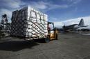 Relief from the U.S. is unloaded from a U.S. military plane at Tacloban airport in central Philippines