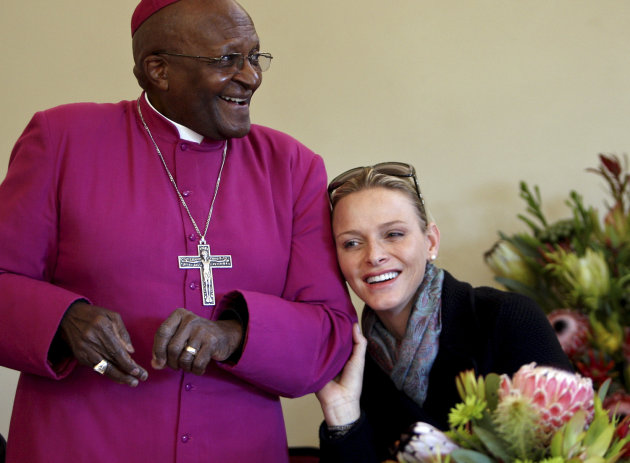 Princess Charlene, right,  of Monaco shares a moment with  South African Archbishop Desmond Tutu, left, during a visit in Cape Town, Friday, July 8, 2011. Charlene  was raised in South Africa, and was
