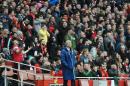Arsenal's Arsene Wenger watches the game from the dug out during the English Premier League soccer match between Arsenal and Chelsea at the Emirates Stadium, London, England, Sunday, April 26, 2015. (AP Photo/Rui Vieira)