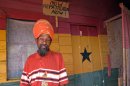 In this Nov. 19, 2012 photo, Rastafarian Priest Noah poses for a photo on the porch of a "holy palace" at the Bobo Ashanti commune in Bull Bay, Jamaica. More people are joining Jamaica's homegrown Rastafarian religion some 80 years after it was founded by the descendants of African slaves in response to black oppression on the Caribbean island. (AP Photo/David McFadden)