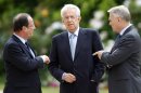 France's President Francois Hollande, left, and Prime Minister Jean-Marc Ayrault, right, speak with Italy's Prime Minister Mario Monti, center, before a working lunch at the Elysee Palace in Paris, Tuesday July 31, 2012. (AP Photo/Charles Platiau/Pool)