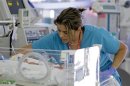 A nurse attends to an infant in the neonatal intensive care unit of the Holtz Children's Hospital at Jackson Memorial Hospital in Miami