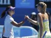 Li Na of China shakes hands with Maria Sharapova of Russia after defeating her in their women's singles semi-final match at the Australian Open tennis tournament in Melbourne