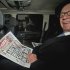 News Corp. chief executive Rupert Murdoch, reads his group's The Sun daily newspaper, as he is driven from his home, in central London, Friday, Feb. 17, 2012. Murdoch is meeting with his British newspaper staff amid police inquiries into alleged misconduct and simmering dissent among the company's rank and file. A total of 10 current and ex-staff at The Sun have been questioned over the alleged payment of bribes to police and defense officials. None have so far been charged.    (AP Photo)