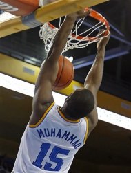 UCLA forward Shabazz Muhammad slam dunks three of his game-high 21 points against Oregon State in the second half of an NCAA men's basketball game in Los Angeles Thursday, Jan. 17, 2013. UCLA won 74-64. (AP Photo/Reed Saxon)