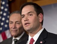 FILE - In this Jan. 28, 2013, photo, Sen. Marco Rubio, R-Fla., right, and Sen. Charles Schumer, D-N.Y., left, join a bipartisan group of leading senators to announce that they have reached agreement on the principles of sweeping legislation to rewrite the nation's immigration laws, during a news conference at the Capitol in Washington. Republicans face a delicate balancing act as they embrace immigration reform _ and no one is more symbolic of the potential risks and rewards than Rubio. (AP Photo/J. Scott Applewhite)