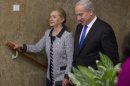 Israel's Prime Minister Benjamin Netanyahu walks with U.S. Secretary of State Hillary Clinton upon her arrival to their meeting in Jerusalem