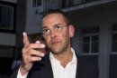 FILE - This is a Sunday July 10, 2011 photo of the then Chief executive of News Corporation Europe and Asia, James Murdoch gesturing as he leaves his father Chairman of News Corporation Rupert Murdoch's residence, in central London. James Murdoch said Wednesday March 14, 2012 'I could have asked more questions' about phone hacking at News International. (AP Photo/Sang Tan, File)