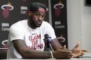 FILE - In this June 17, 2014 file photo, Miami Heat's LeBron James gestures as he answers a question during a news conference in Miami. A person familiar with the situation tells The Associated Press that James has decided to opt out of the final two years of his contract with the Heat and become a free agent on July 1. Opting out does not mean James has decided to leave the Heat, said the person, who spoke on condition of anonymity because neither the four-time NBA MVP nor the team had made any public announcement. (AP Photo/Alan Diaz, File)