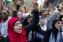 Supporters of ending the violence in Gaza yell at a rally near Columbus Circle during a protest in New York, Saturday, Aug. 9, 2014. (AP Photo/Craig Ruttle)