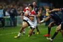 Japan's wing Yoshikazu Fujita (C) runs with the ball during a Pool B match of the 2015 Rugby World Cup against the USA at Kingsholm stadium in Gloucester, west England, on October 11, 2015
