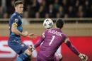 Arsenal's Olivier Giroud, left, faces Monaco's goalkeeper Danijel Subasic during their Champions League round of 16 second leg soccer match between Monaco and Arsenal at Louis II stadium in Monaco, Tuesday, March 17, 2015. (AP Photo/Christophe Ena)