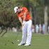 Rory McIlroy, of Northern Ireland, hits an approach shot to the third green during the third round of the Honda Classic golf tournament in Palm Beach Gardens, Fla., Saturday, March 3, 2012.  (AP Photo/Rainier Ehrhardt)