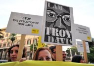 Amnesty International activists hold banners in support of Troy Davis in front of the US Embassy in Rome, during a protest to denounce the death penalty in the United States. Davis was sentenced to death in 1991