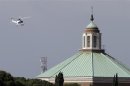 The helicopter carrying Pope Emeritus Benedict XVI flies before landing at the Vatican