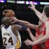 Lakers shooting guard Bryant battles Rockets small forward Parsons and Rockets center Asik for the ball during the second half of their NBA basketball game in Los Angeles
