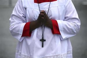 An altar boy prays during a mass service inside the&nbsp;&hellip;