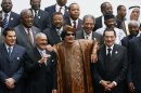 FILE - In this Oct. 10, 2010 file photo, Libyan leader Moammar Gadhafi, center, with Egyptian President Hosni Mubarak, right, and his Yemeni counterpart Ali Abdullah Saleh, center left, pose for a group photo with Arab and African leaders during the second Afro-Arab summit in Sirte, Libya, Today, Saleh is out of power, Ben Ali is in exile, Mubarak is on trial and Gadhafi is dead, killed by rebel fighters. Their countries are enduring often-painful transitions. (AP Photo/Amr Nabil)