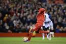 Liverpool's Italian striker Mario Balotelli scores from the penalty spot during the UEFA Europa League round of 32 first leg football match between Liverpool and Besiktas in Liverpool, England, on February 19, 2015