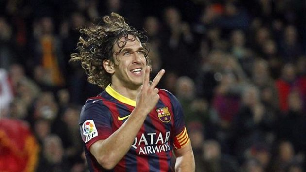 Barcelona's Carles Puyol celebrates a goal against Almeria during their Spanish first division soccer match at Camp Nou stadium in Barcelona March 2, 2014 (Reuters)