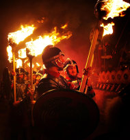 Members of the Jarl Squad dressed in Viking costumes in Lerwick, on the Shetland Isles, off the north-east coast of Scotland, during the Up Helly Aa Viking festival on Tuesday Jan. 31, 2012. Hundreds of costumed guizers carrying torches took to the streets of a Scottish island during the annual Up Helly Aa festival. Originating in the 1880s, the tradition which celebrates Shetland's Norse heritage, sees around 900 guizers drag a Viking galley through the streets of Lerwick, led by a horde of 'Vikings'. The festival, that attracts thousands of revelers each year , culminates in the burning of the Viking galley. (AP Photo / Danny Lawson/PA) UNITED KINGDOM OUT NO SALES NO ARCHIVE