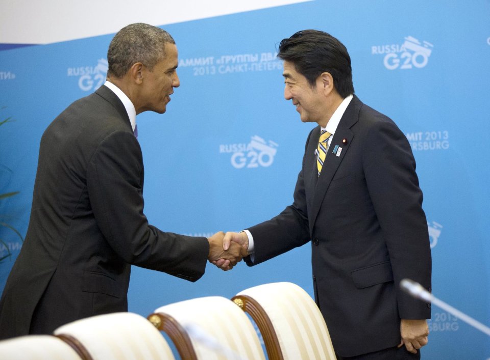 US President Barack Obama, left, and Japan's Prime Minister Shinzo Abe, right, shake hands before the start of their bilateral meeting at the G20 Summit, Thursday, Sept. 5, 2013 in St. Petersburg, Russia. (AP Photo/Pablo Martinez Monsivais)