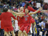 Louisville players including Cortnee Walton (13) celebrate after a national semifinal against California at the Women's Final Four of the NCAA college basketball tournament, Sunday, April 7, 2013, in New Orleans. Louisville won 64-57. (AP Photo/Dave Martin)